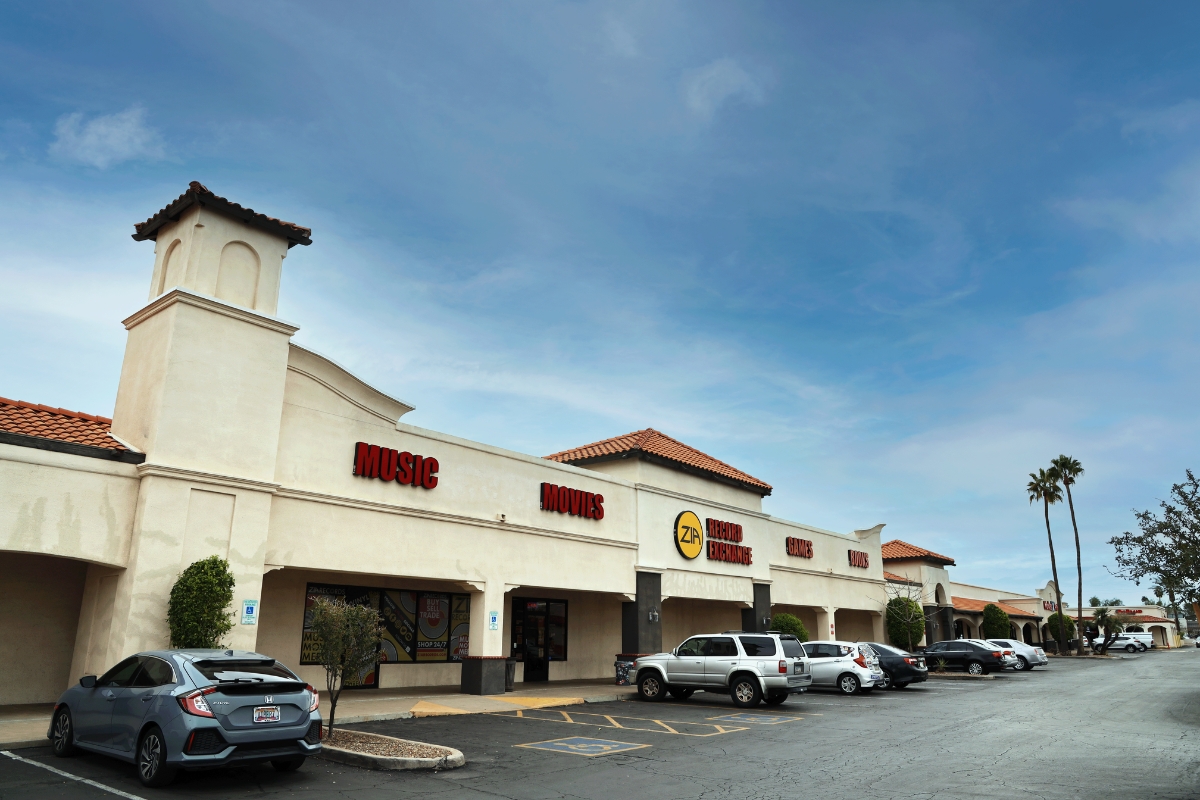 shopping center with some cars parked in front