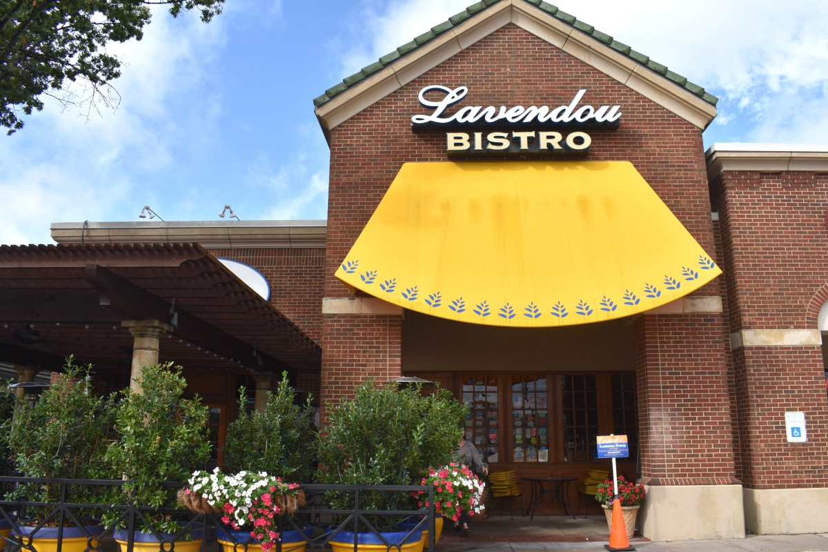 brick restaurant with yellow awning