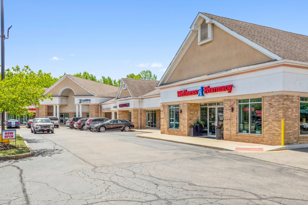 shopping center with cars parked in front