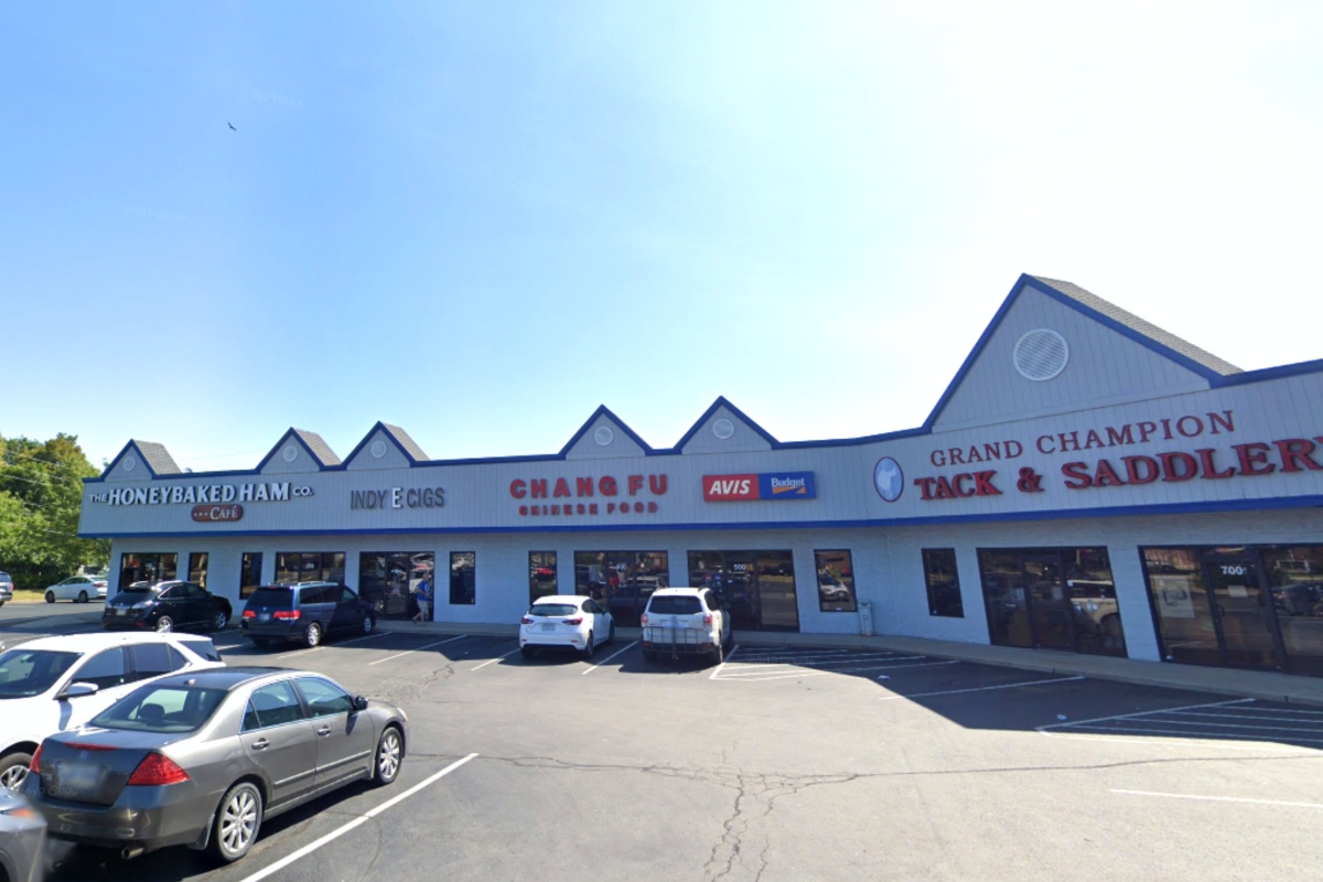 shopping center with cars parked in front