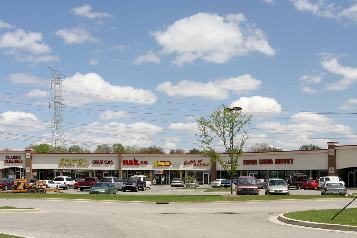 shopping center with cars parked in front