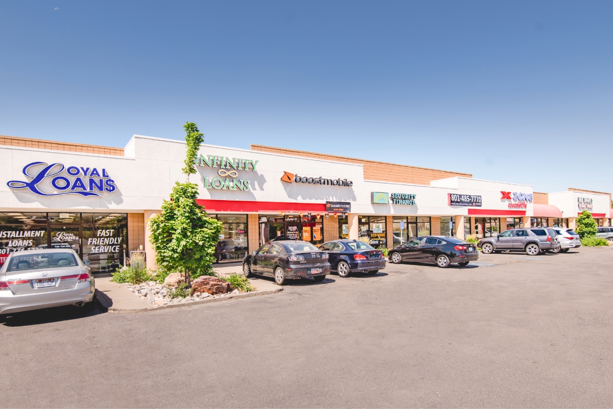 shopping center with cars parked in front