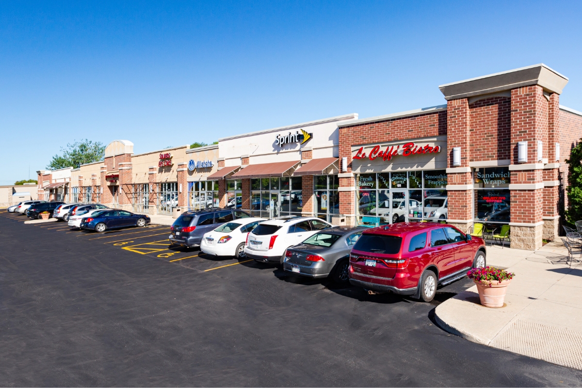shopping center with cars parked in front